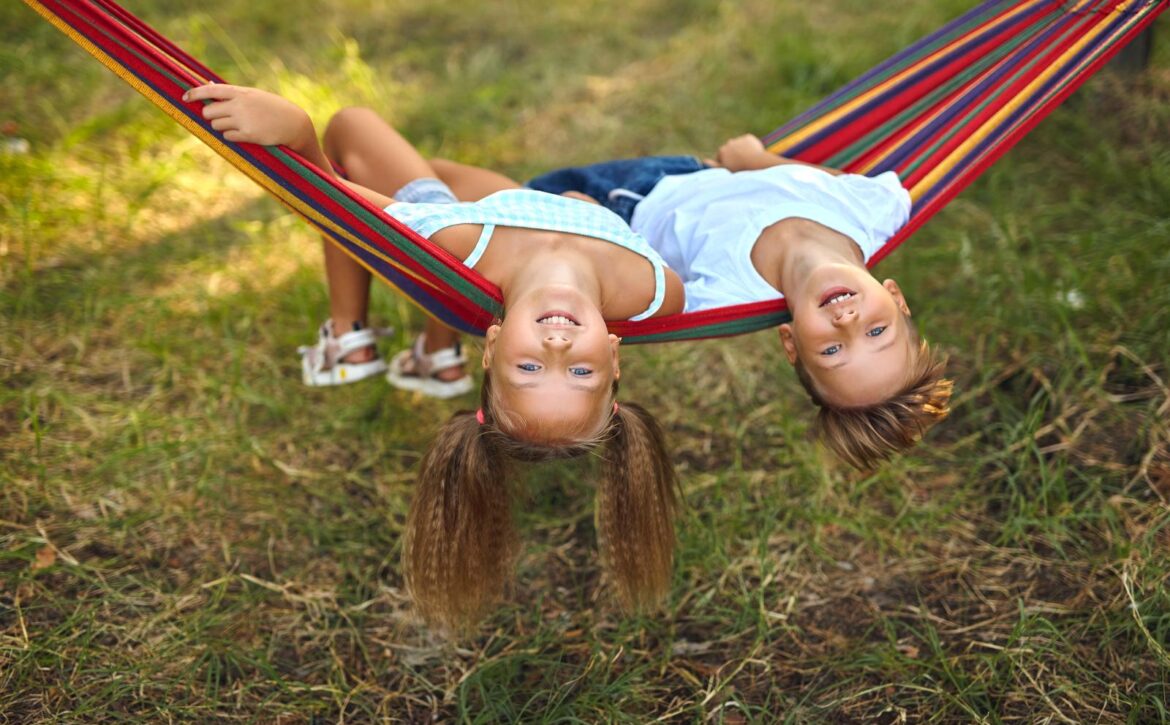 Fun in the garden kids playing in colorful hammock