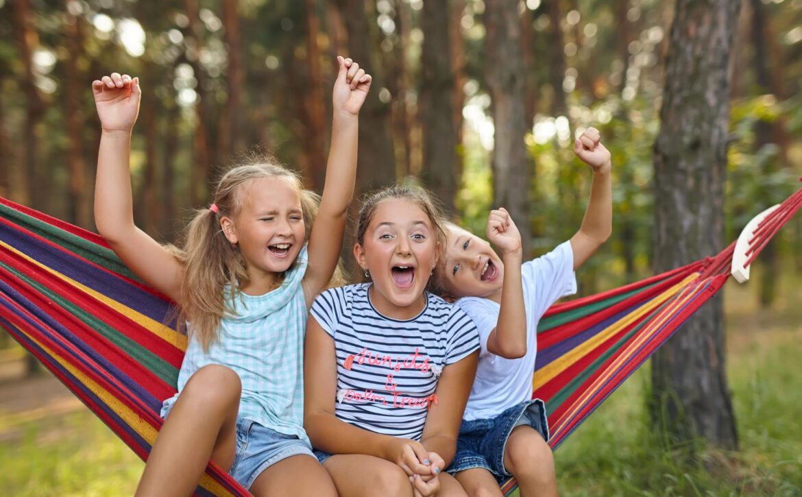 Fun in the garden kids playing in colorful hammock